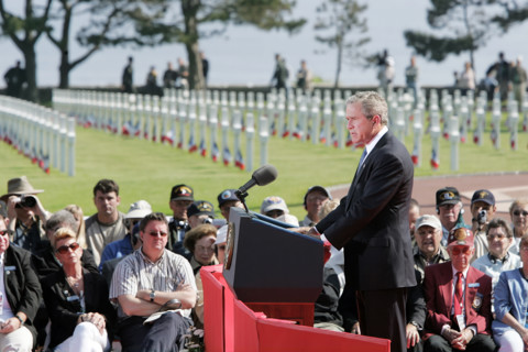 U.S. President George W. Bush addressing World War II veterans and families during 60th anniversary