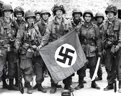 American paratroopers, among the first to make successful landings on European continent, holding