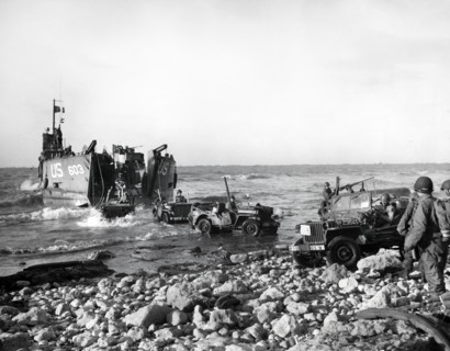 U.S. Army Jeeps of 5th Engineer Special Brigade debark from LST at Fox Green, Omaha Beach,