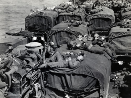 American assault troops aboard landing craft enroute from England to Cherbourg, France, U.S. Army
