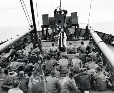 Chaplain Louis R. Goodrich, San Antonio, Texas, conducting religious services aboard an