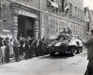 U.S. Major General Lindsay McDonald Silvester, 7th Armored Division, receiving cheers from French