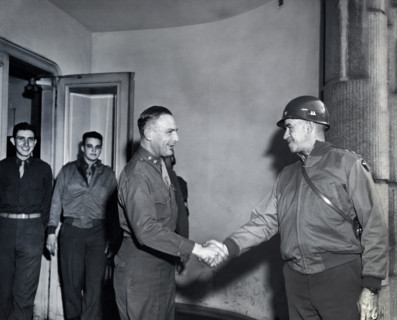 U.S. Lieutenant General Omar N. Bradley (right), 12th Army Group, shaking hands with U.S. Major