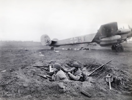 U.S. G.I.'s watching for enemy activity from their outpost at German airfield captured by U.S.