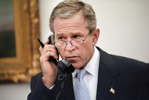 U.S. President George W. Bush talking on telephone, White House Oval Office, Washington, D.C., USA,
