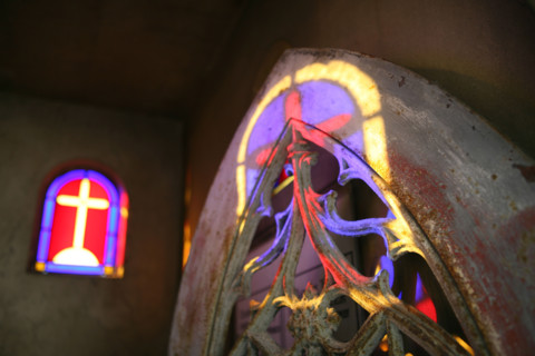 France, reflection of a cross in a chapel