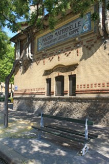 France, Detail of the school facade de la tombe issoire