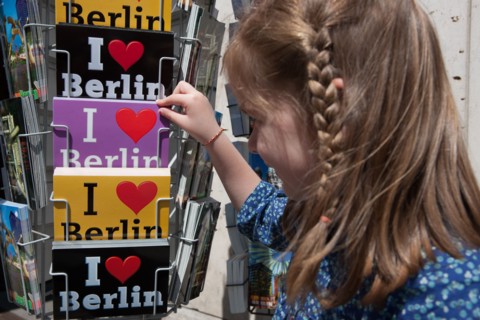 Germany, Berlin, child choosing postcards