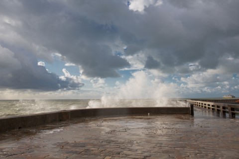 Wave flooding the dyke