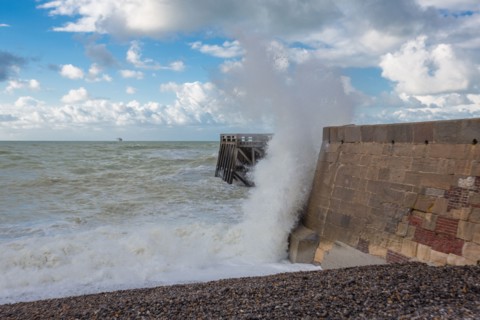Wave flooding the dyke