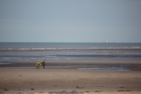 Le Touquet Paris Plage, fishermen in yellow oilskins