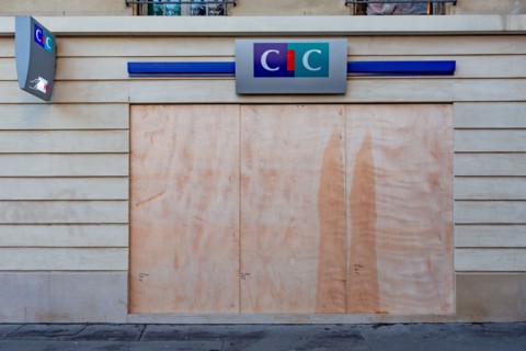 Paris, windows of a bank protected with sealed wood panels