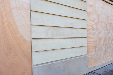Paris, windows of a bank protected with sealed wood panels