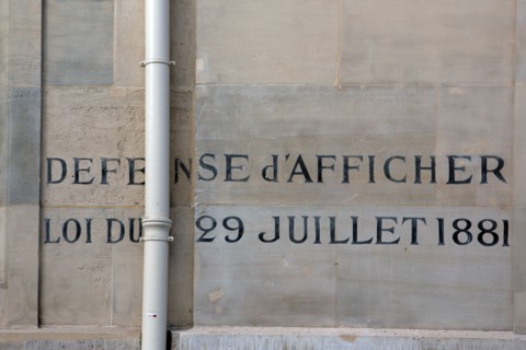 Paris, graffiti on a wall that reads 'Défense d'afficher'