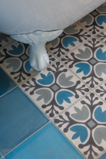 Cement tiles and old-fashioned bathtub base