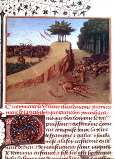 Charlemagne kneeling near Roland at Roncevaux