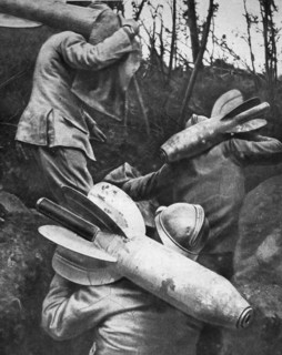 A man carries a shell on his back.