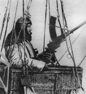 Machine gunner observes from the car of a "sausage" (dirigible balloon).