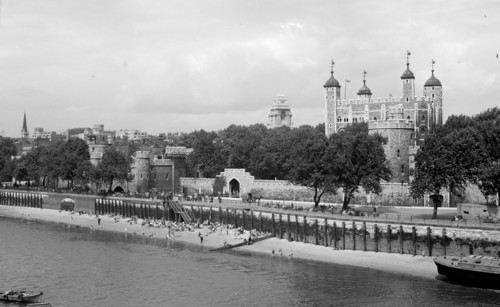 People relaxing on Tower Beach, London, c1945-c1955