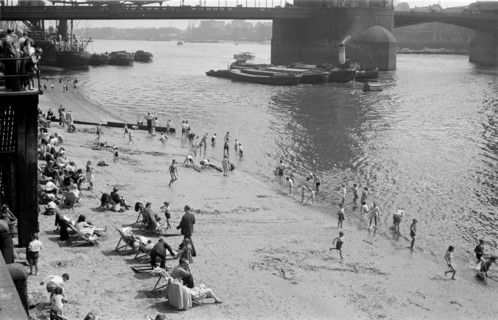 People relaxing on Tower Beach, London, c1945-c1955