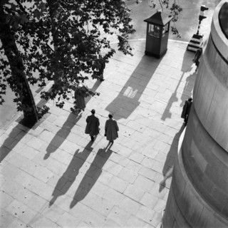 Pedestrians on the Victoria Embankment, London, seen from Waterloo Bridge