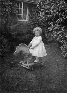 Child on a wooden horse, c1896-c1920