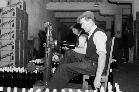 Sealing bottles of port wine at the Cutler Street warehouses, London, c1945-1965