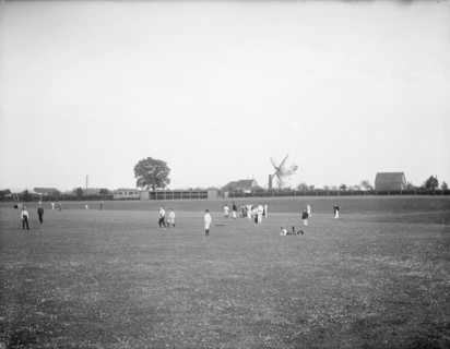 Boys playing cricket, with Thame windmill in the background, Thame, Oxfordshire, c1860-c1922