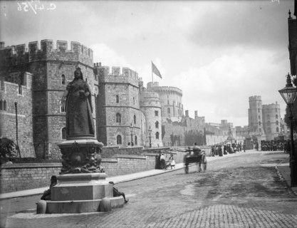 Windsor Castle from Pedscoe Street with a statue of Queen Victoria, Windsor, Berkshire, c1860-c1922