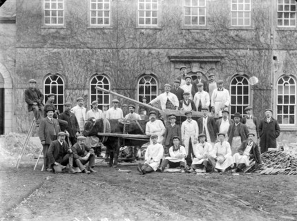 Workmen posing outside a house with a bullock cart, Kingston Lisle, Oxfordshire, c1860-c1922