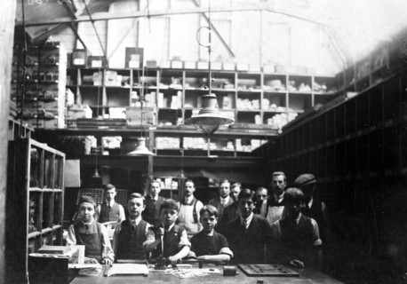 Men and boys in a printing workshop, (late 19th-early 20th century?). Artist: Unknown