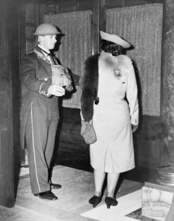Linkman at the Trocadero wearing a tin hat, Westminster, London, October 1940. Artist: Unknown