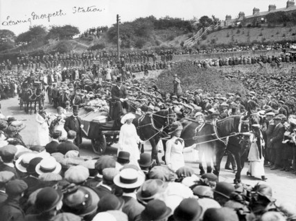 A large crowd watches Emily Wilding Davison's funeral procession 15th June 1913. Artist: Unknown