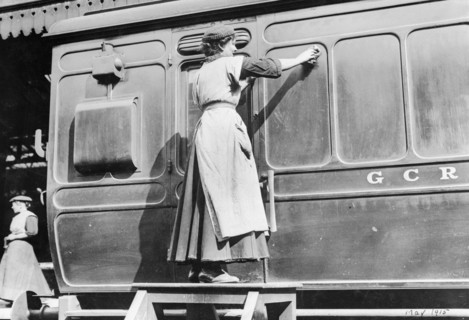 A woman cleaning railway carriages at Marylebone station, April 1915. Artist: Unknown