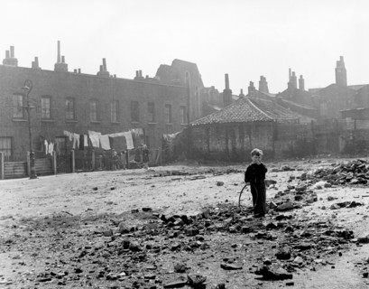 Boy playing on sewage works, East End, London, c1951. Artist: Henry Grant
