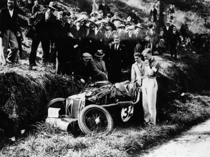 Goldie Gardner by the wreckage of an MG J4, 1932. Artist: Unknown