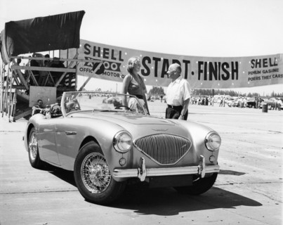 Donald Healey with an Austin Healey at a motor race. Artist: Unknown