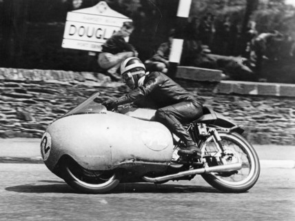 Bill Lomas at Governor's Bridge, Isle of Man Junior TT, 1955. Artist: Unknown