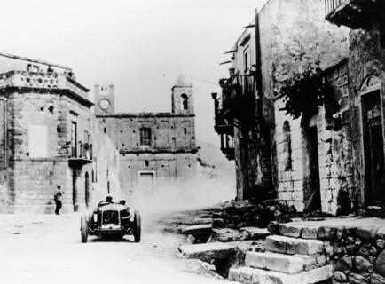 Achille Varzi in a P2 Alfa Romeo Grand Prix car, in the Targa Florio race, Sicily, 1930. Artist: Unknown