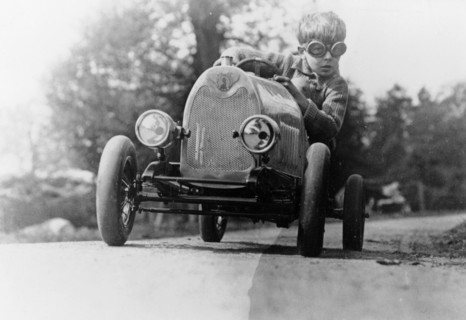 Boy in a pedal car. Artist: Unknown