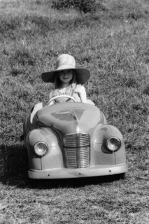 Girl in a 1948 vintage Austin J40 pedal car. Artist: Unknown