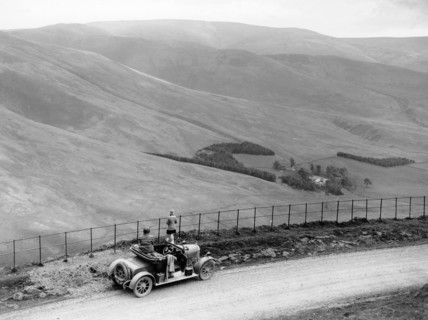 People with a Morris Cowley at the Devil's Beef Tub, Scotland, (c1930s?). Artist: Unknown