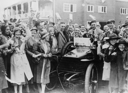 A 1904 Wolseley amidst a crowd of cheering people, Brooklands, Surrey, late 1920s-early 1930s. Artist: Unknown