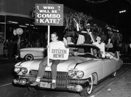 Fancy dress parade with a 1957 Cadillac, USA, (c1957?). Artist: Unknown