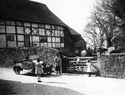 Calcott 2-seater car parked outside a farm gate, c1921-c1922. Artist: Unknown