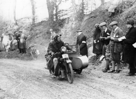 A competitor riding a Norton, competing in the Colmore Cup Trial, 1921. Artist: Unknown