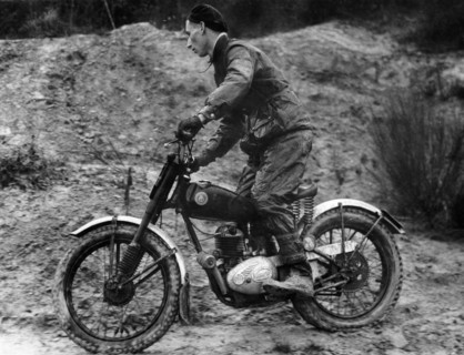 Cullen riding a Francis Barnett bike at the J White Trial. Artist: Unknown