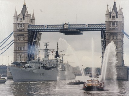 View of HMS London sailing beneath Tower Bridge, London, 1988. Artist: Anon