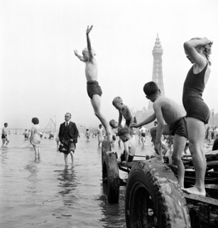 Children in swimming costumes jump into the sea, Blackpool, c1946-c1955