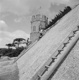 Thatchers at work on the roof of St Peter's Church, Theberton, Suffolk, 1956 Artist